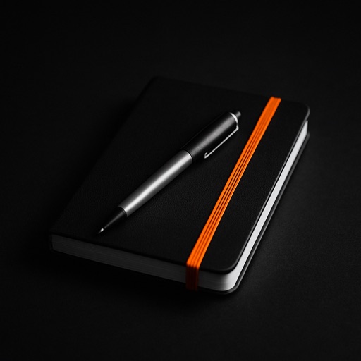 Notebook with an orange elastic band
